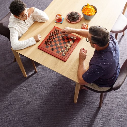 people playing chess carpeted floor Komplete Flooring Inc Siren, WI